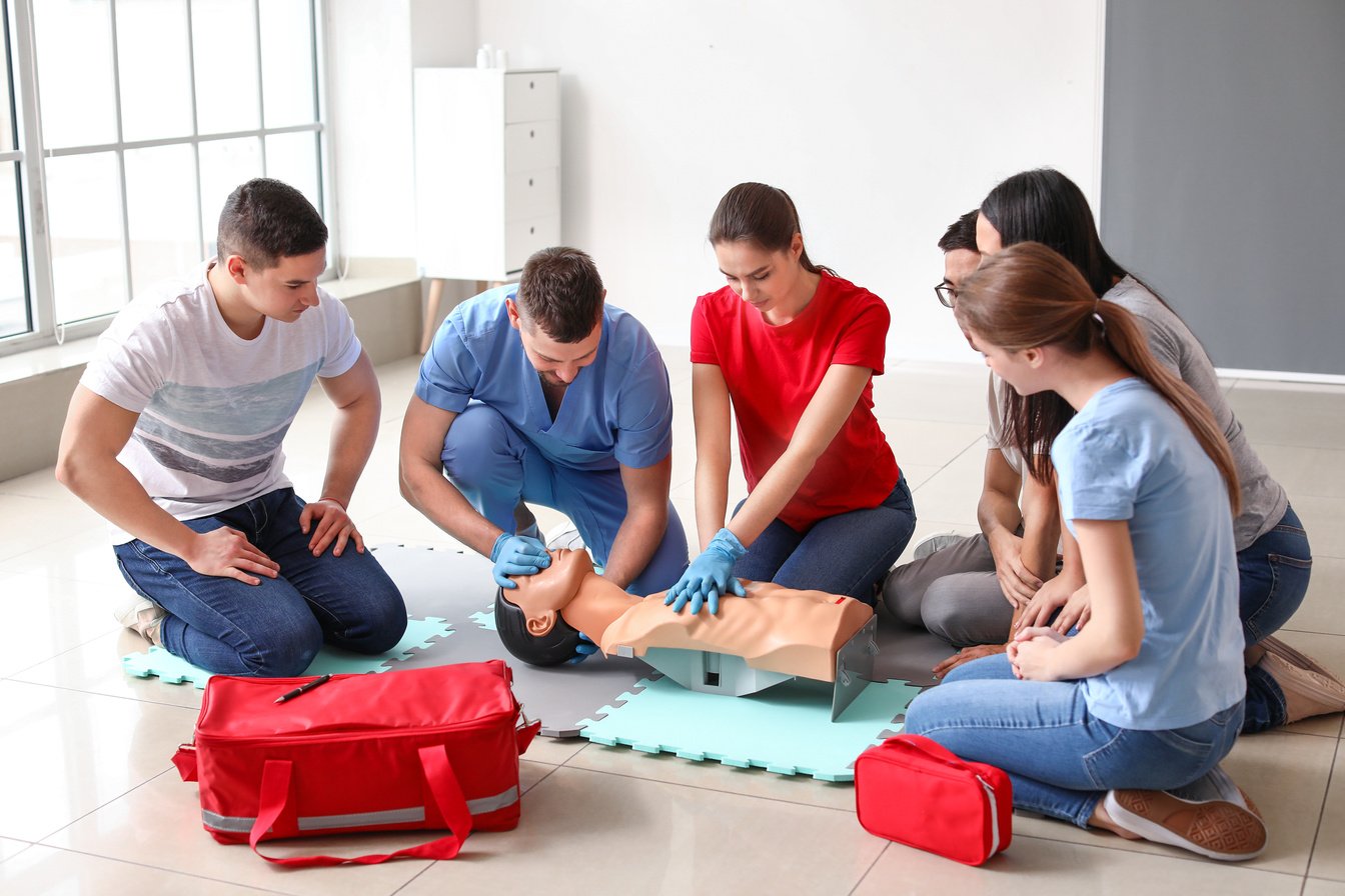 Instructors Demonstrating CPR on Mannequin